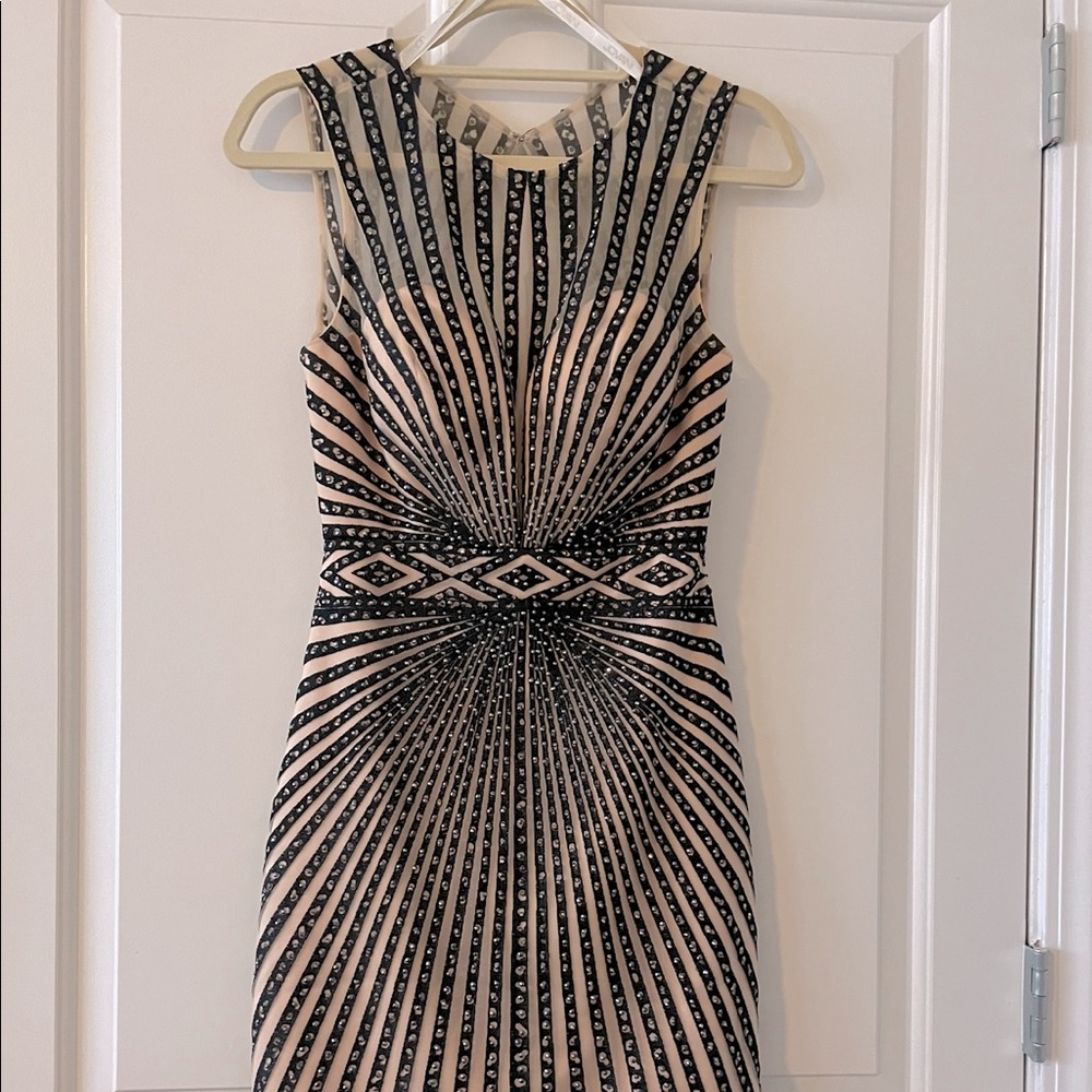 Nude and black cocktail size four only worn once jovani- worn at Miss America